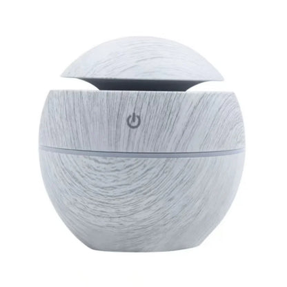 Mini nawilżacz powietrza USB w stylu drewna, ultradźwiękowy, z mgiełką, aromaterapią i kolorowym podświetleniem LED.